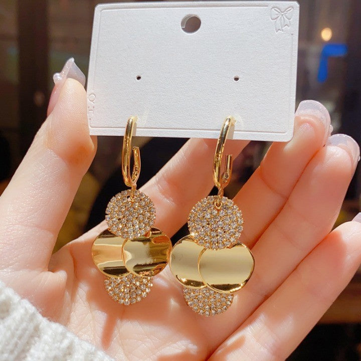 		Crystal Radiance Round Tassel Earrings	